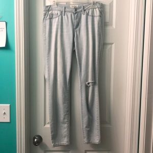 Jessica Simpson washed out ripped jeans